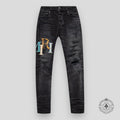 Amiri Staggered Logo Denim Jeans in Black